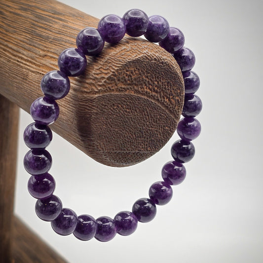 Amethyst Beaded Bracelet on Wood Stand - Symbol of Serenity and Spiritual Awakening