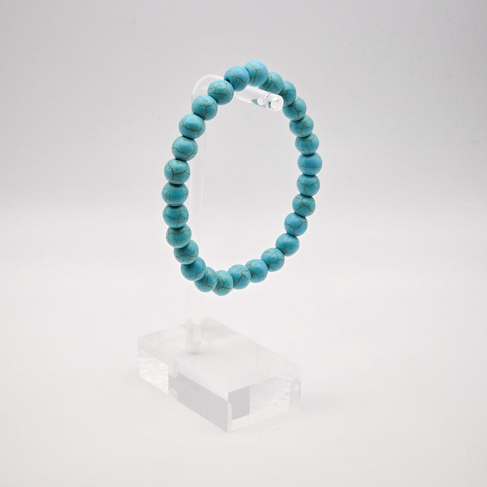 Elegant Turquoise Bracelet Display on Acrylic Stand - Symbolizing Healing and Good Fortune