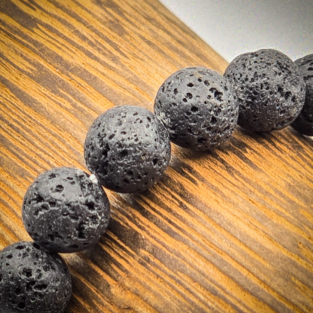 Detailed View of Lava Stone Beads - Natural Texture Symbolizing Courage and Calm