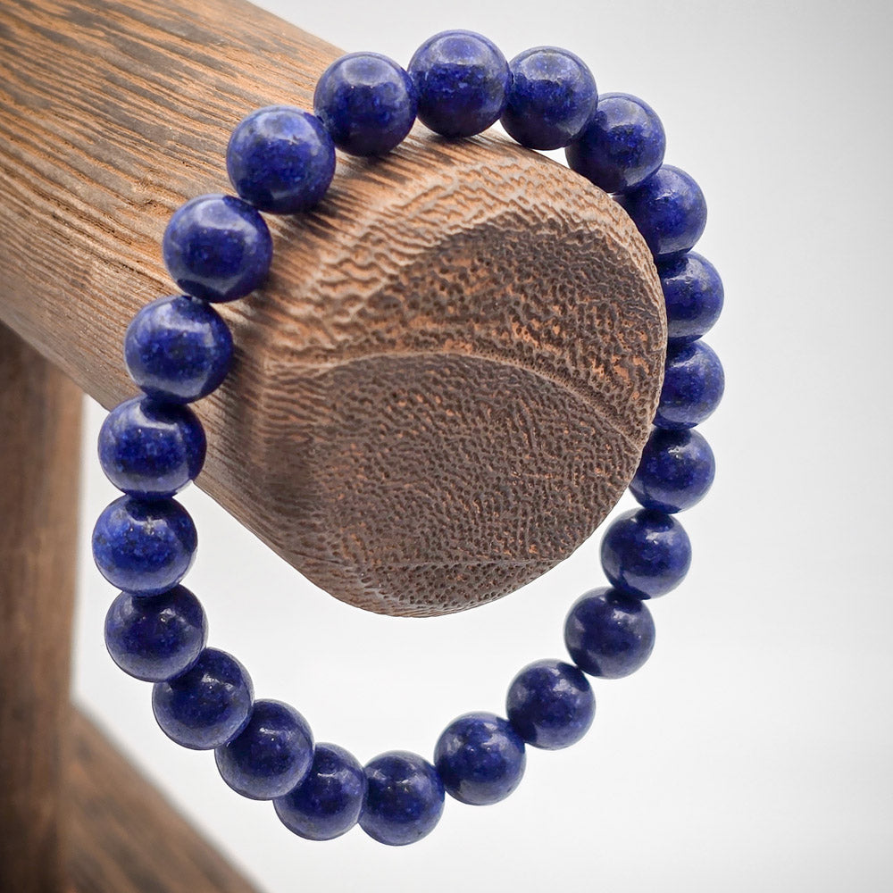 Lapis Lazuli Beaded Bracelet on Wood Stand - Journey Towards Spiritual Enlightenment.