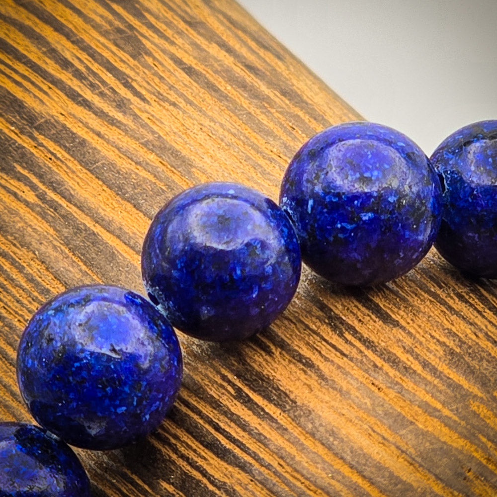 Detail of Lapis Lazuli Beads - Deep Blue Stones Sparkling with Golden Flecks for Self-Awareness.