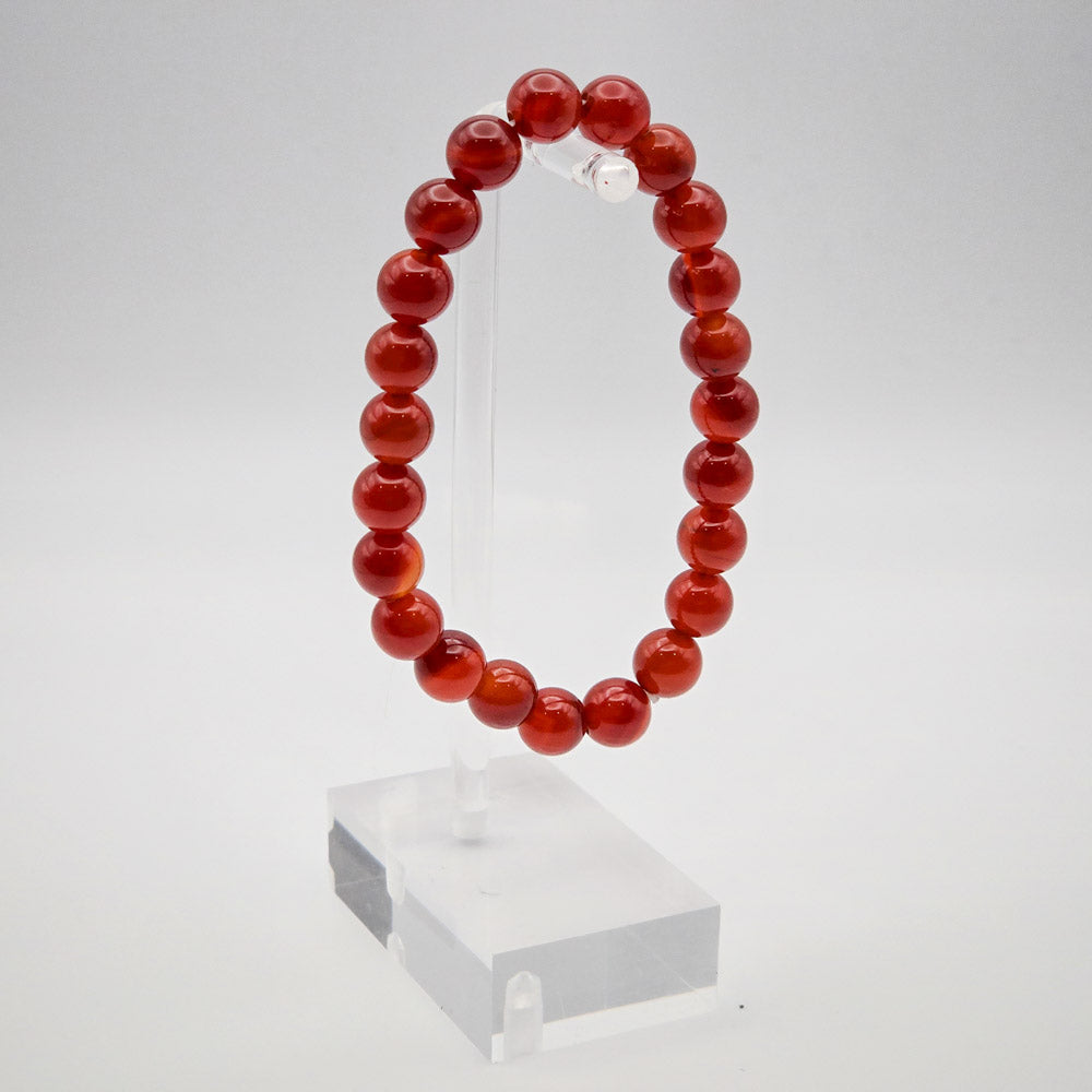 Elegant Carnelian Bracelet Display on Acrylic Stand - Symbolizing Love, Motivation, and Empowerment