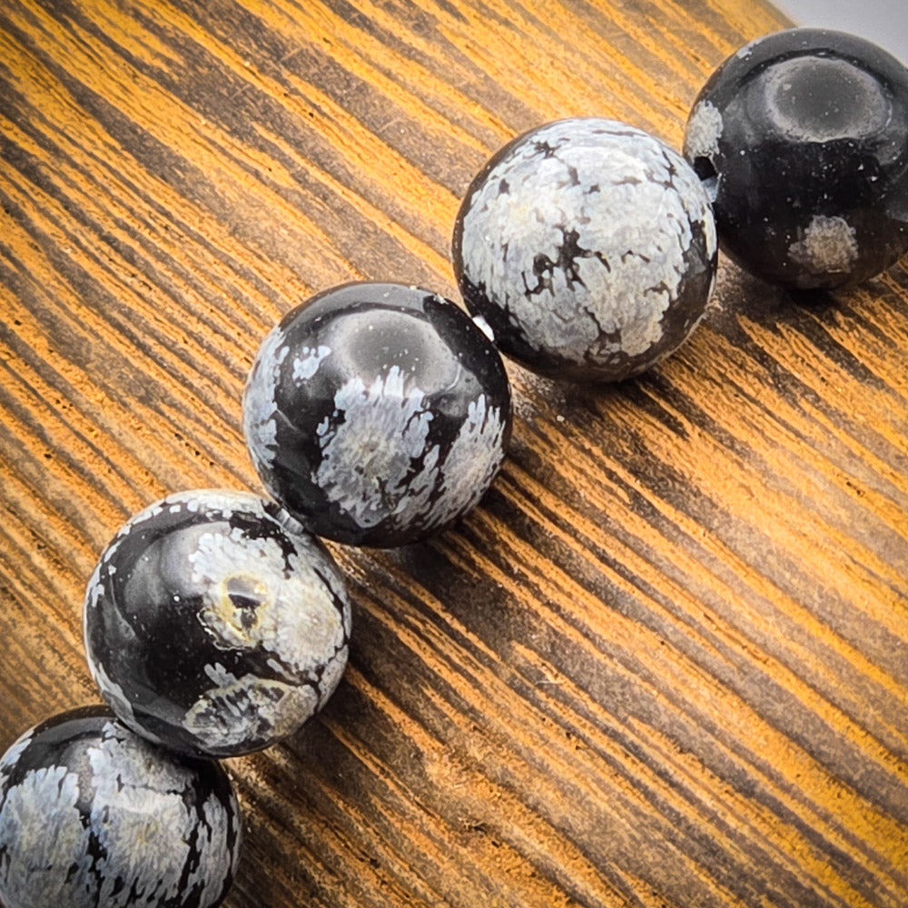 Detail of Snowflake Obsidian Beads - Reflecting Mental Clarity and Stress Release.