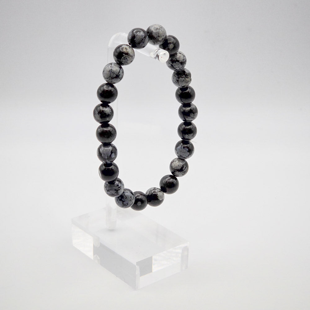 Elegant Snowflake Obsidian Bracelet Display - Embracing Mental and Spiritual Balance.