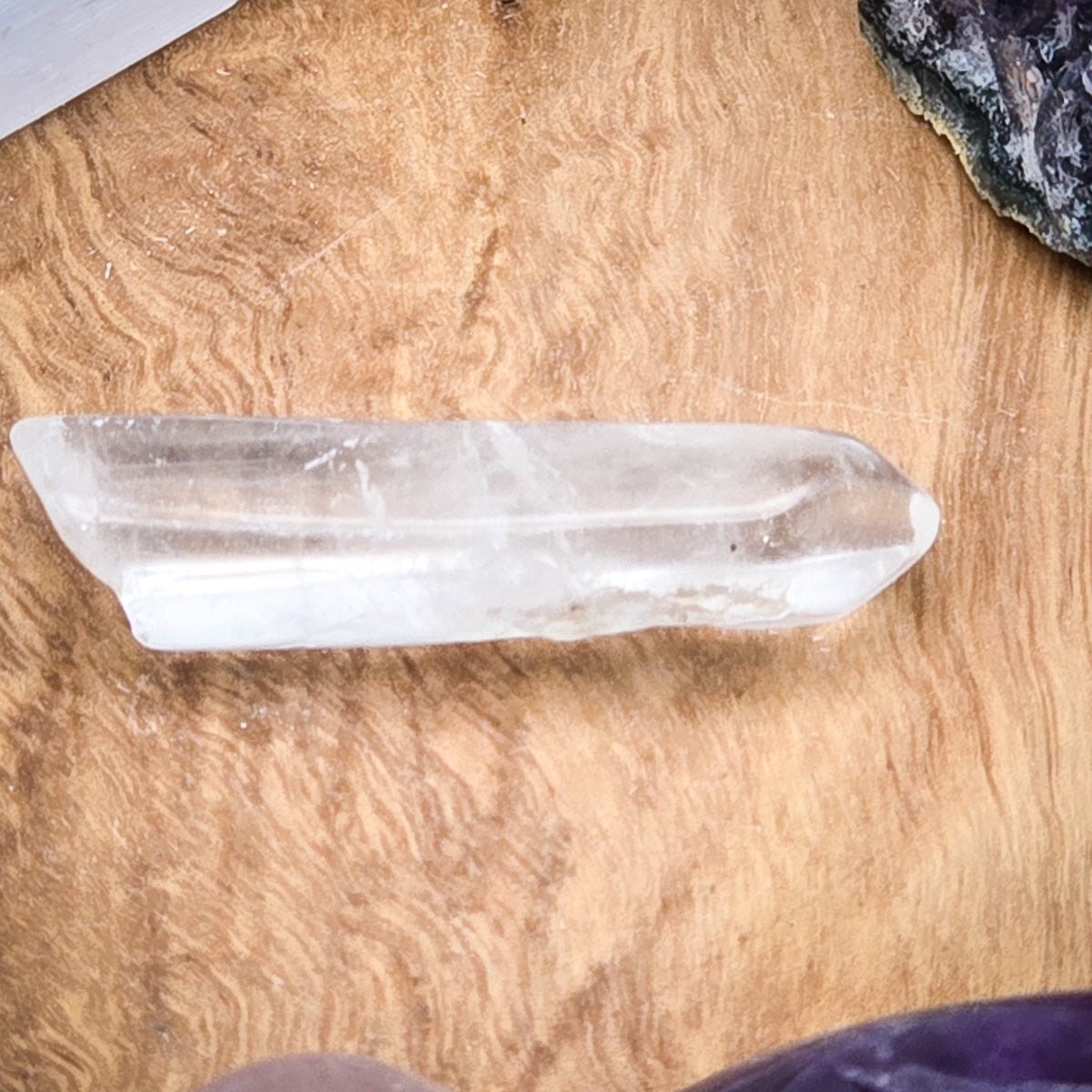 Detailed view of the quartz crystal on a wooden backdrop