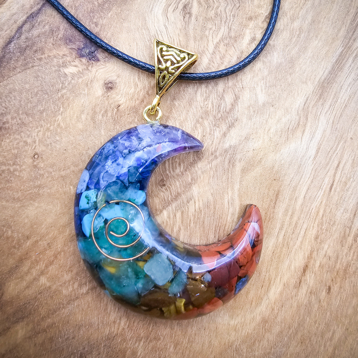 Close-up of the colorful chakra pendant on the necklace