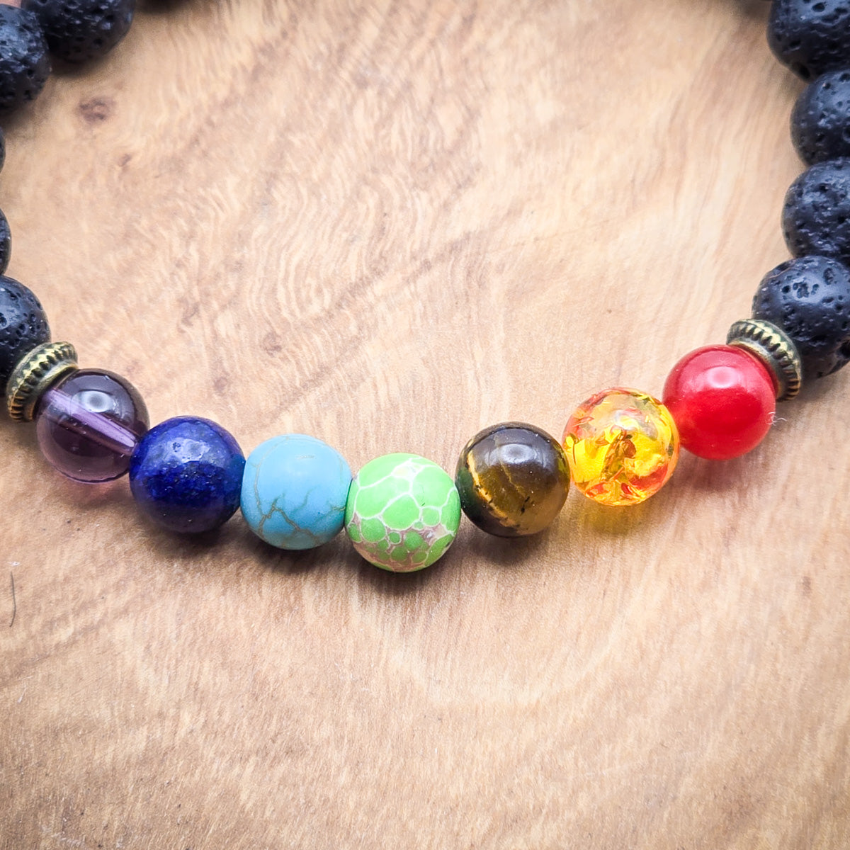 Detailed view of the elastic chakra bracelet with vibrant beads