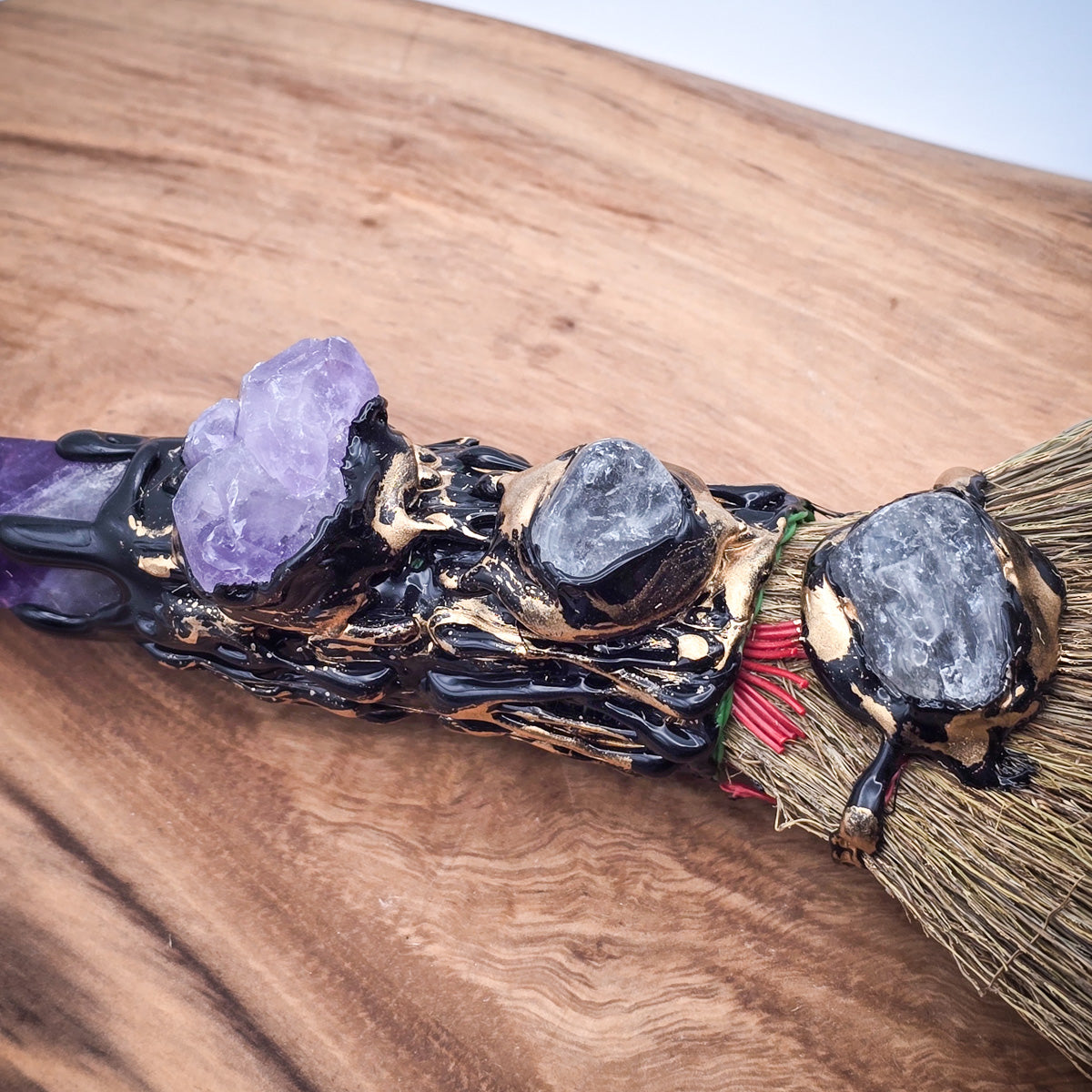 Close-up of Amethyst Cleansing Sweep, showcasing its amethyst tip and natural craftsmanship.