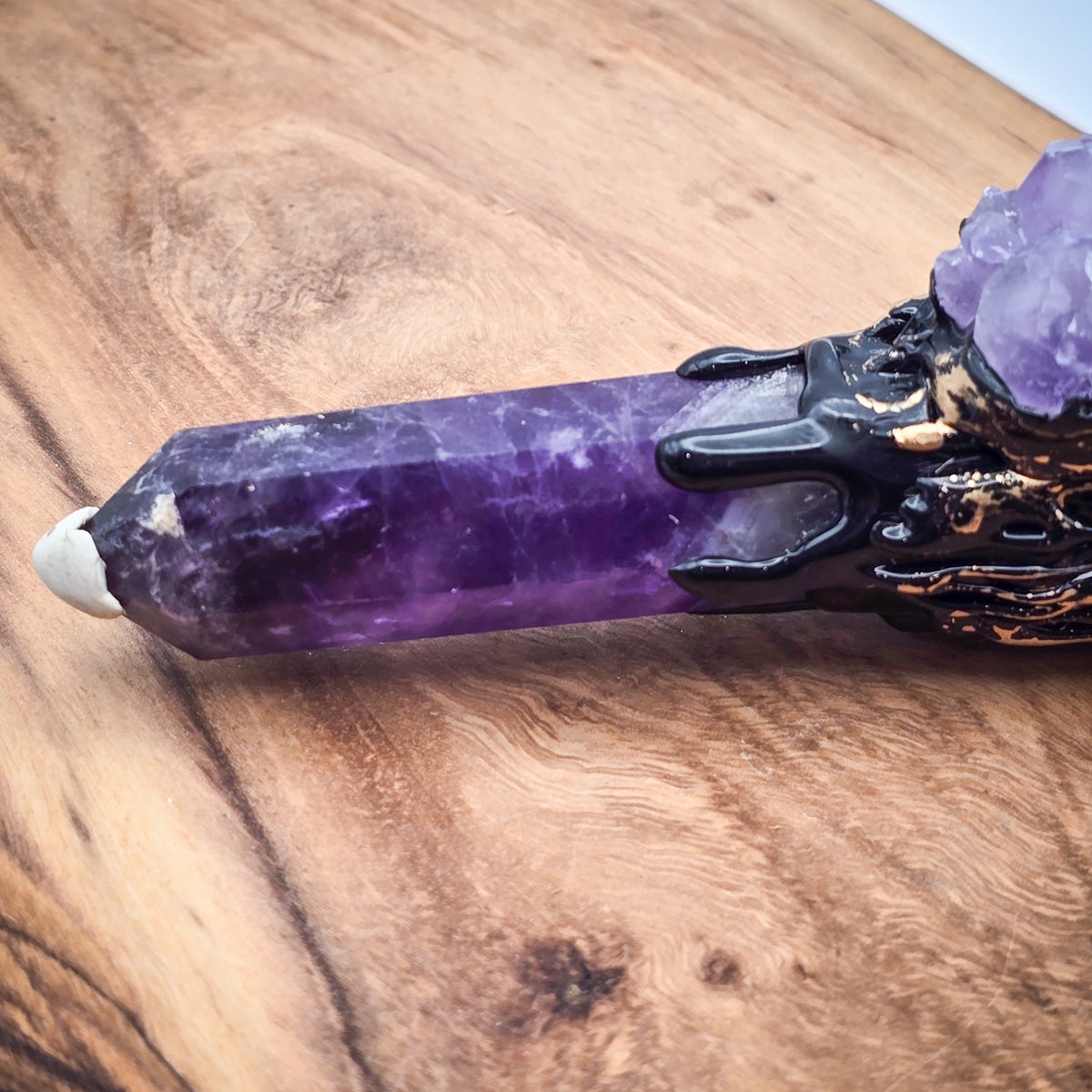 The Amethyst Cleansing Sweep, a tool for meditation and purification, emphasizing its unique crystal broom design.