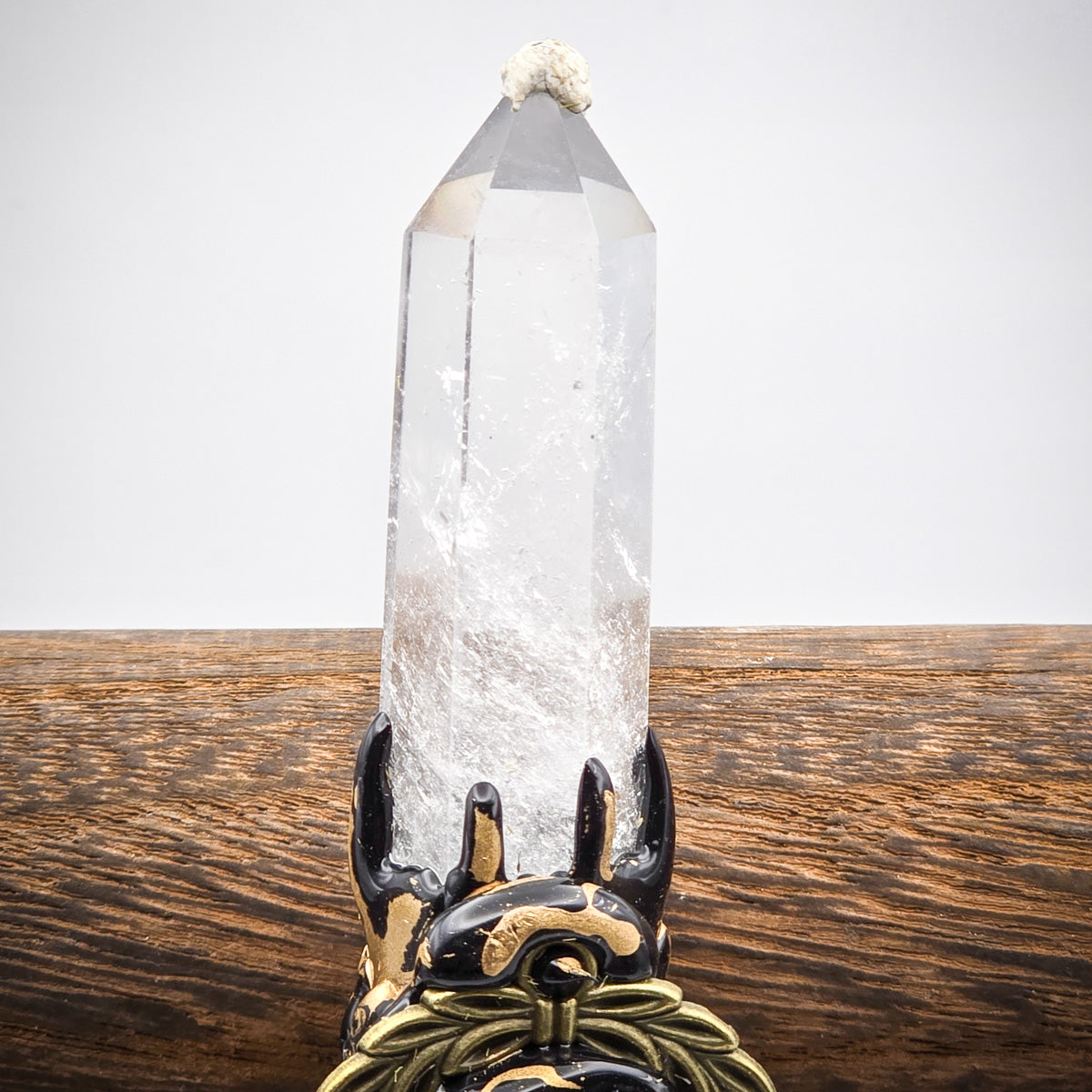 Detailed view of Quartz crystal point, emphasizing the purity and brilliance of the clear quartz.