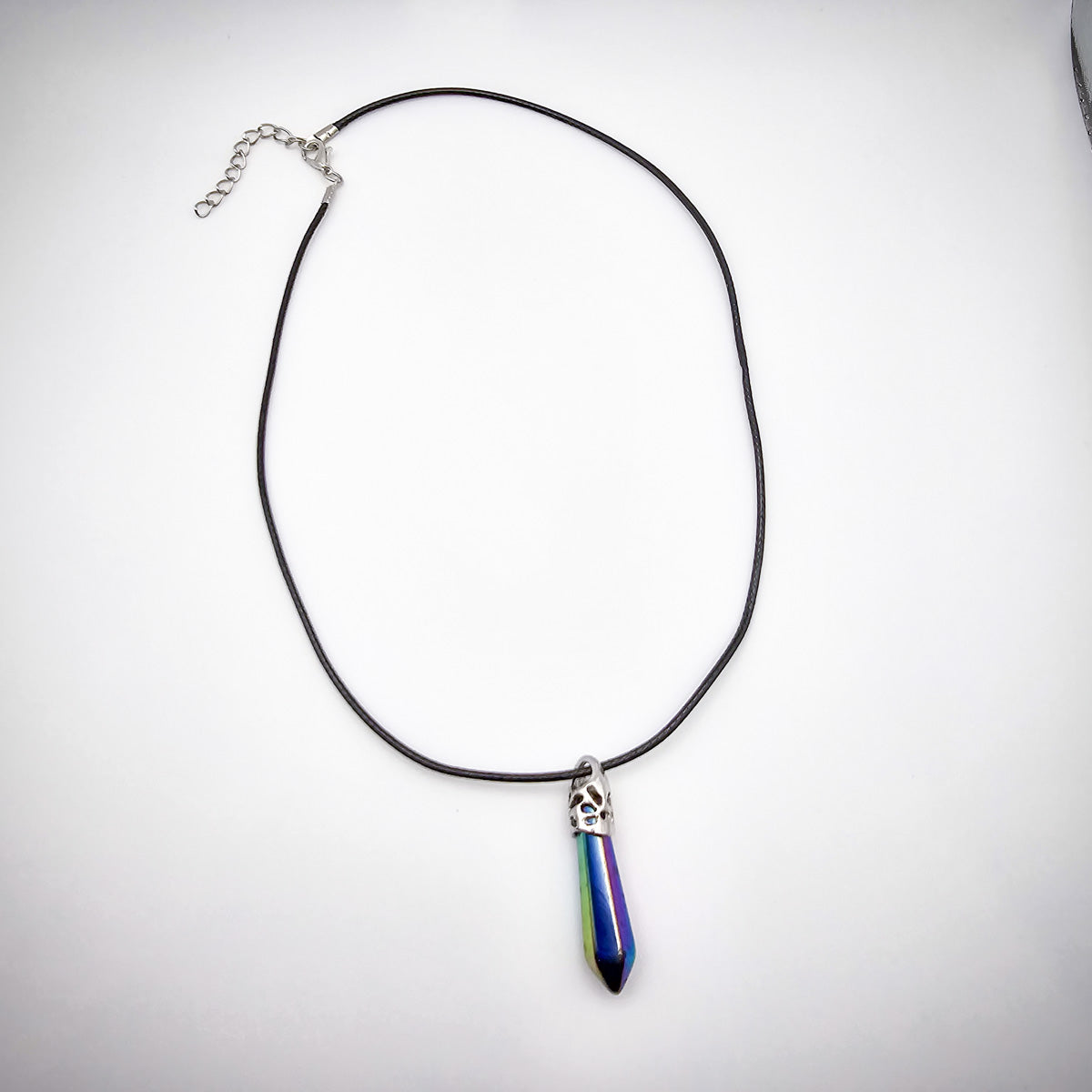 Full view of the Titanium Aura Quartz pendant necklace on a white background, highlighting the elegant black cord and the pendant's colorful brilliance.