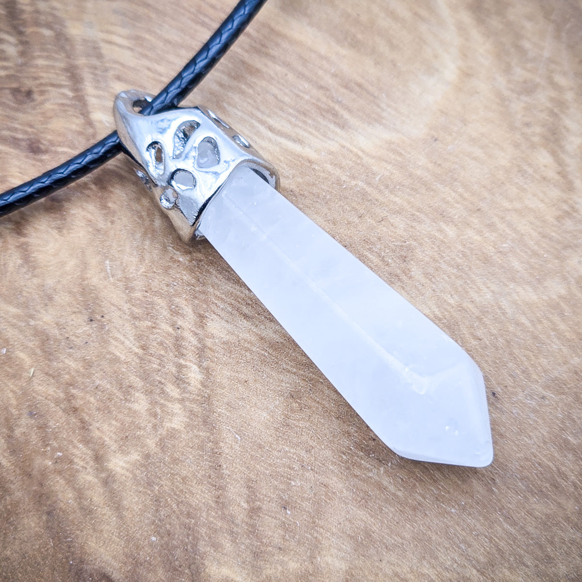 Close-up view of the Clear Quartz hexagonal pendant, showcasing the crystal's natural clarity and purity.