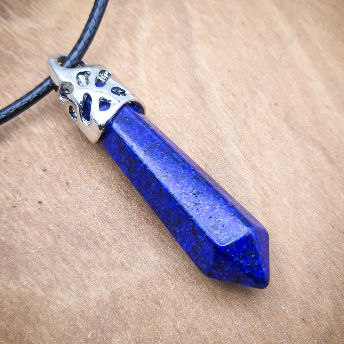 Close-up of the Lapis Lazuli hexagonal pendant, highlighting the exquisite blue color and the natural textures that make this stone so sought after.