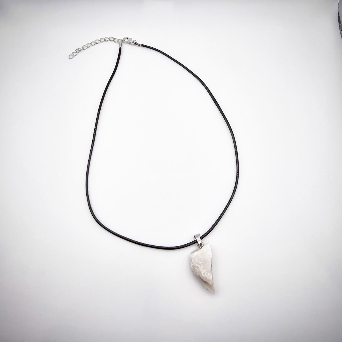 Full display of the Moonstone pendant necklace against a white background, emphasizing the complete elegance of the black cord and gemstone.