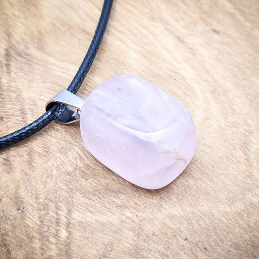 Polished Rose Quartz cube pendant on an 18" black cord, embodying the essence of love and harmony.