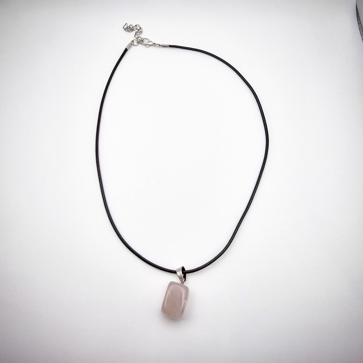 Entire Rose Quartz cube pendant necklace against a white background, highlighting the minimalist elegance and symbolic significance.