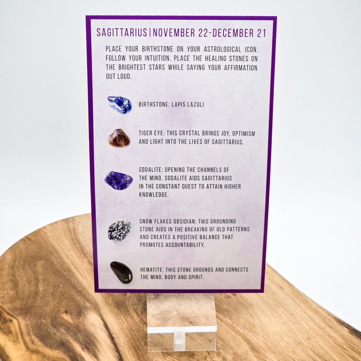 Reverse side of the Sagittarius card showing what crystals the bag contains.  Sitting on a wood block with white background.