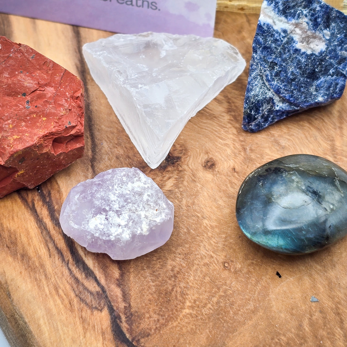 Intimate close-up of the 'Meditation & Mindfulness' Mojo Bag’s crystals, highlighting their unique shapes and colors meant for spiritual enhancement.