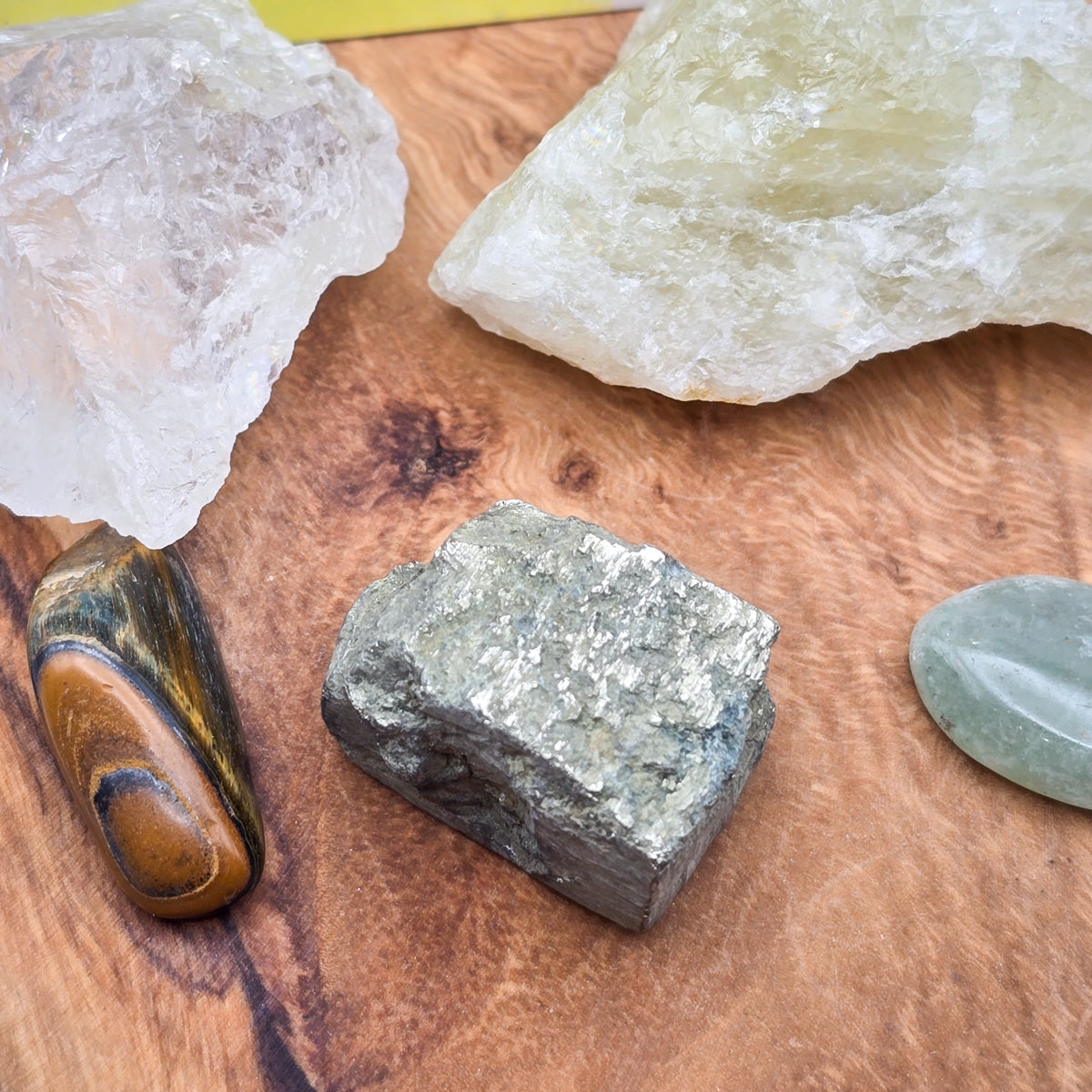 Intimate close-up of the polished and raw crystals from the 'Abundance & Prosperity' Mojo Bag, showcasing the natural beauty and varied textures