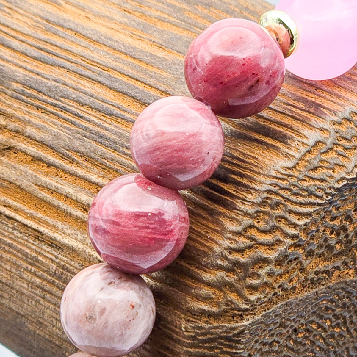 Close-up of rhodonite and pink beads - detailed elegance