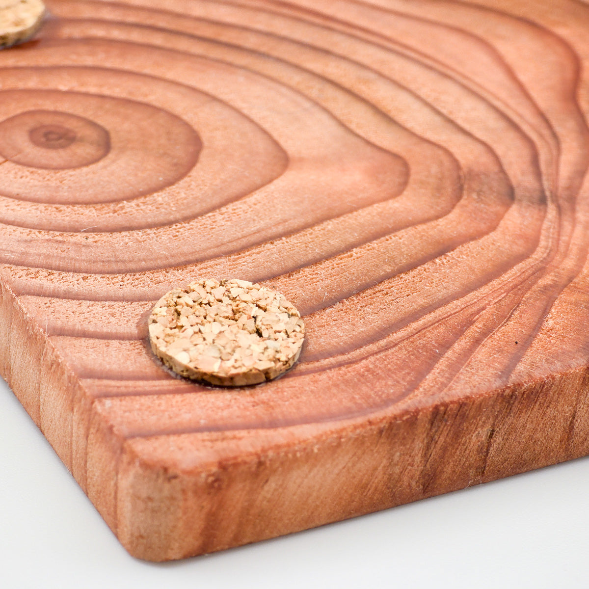 Close-up view of natural cork base on a Redwood Coaster, ensuring slip resistance and surface protection.